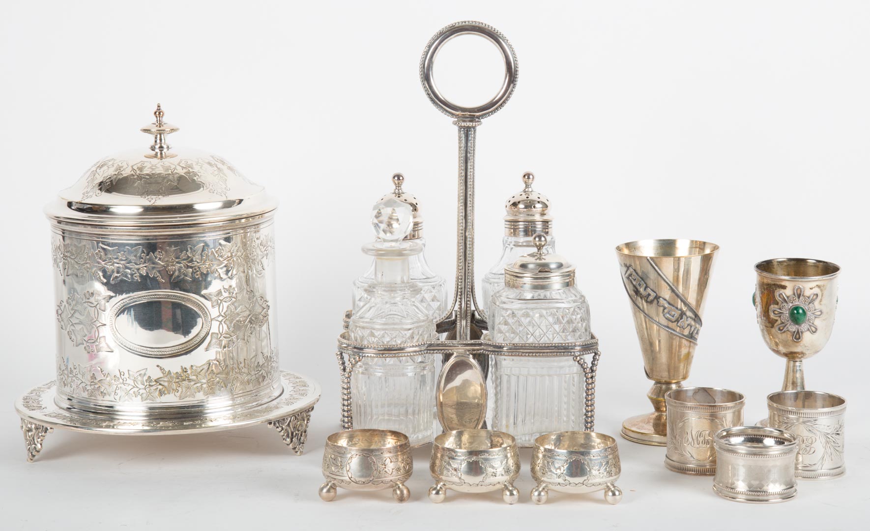 Appraisal: English Sheffield silver-plated cruet stand with cut glass bottles together