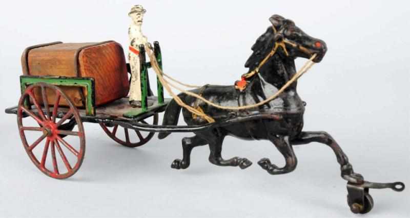 Appraisal: Cast Iron Horse-Drawn Wagon Toy American Flat figure pulled by