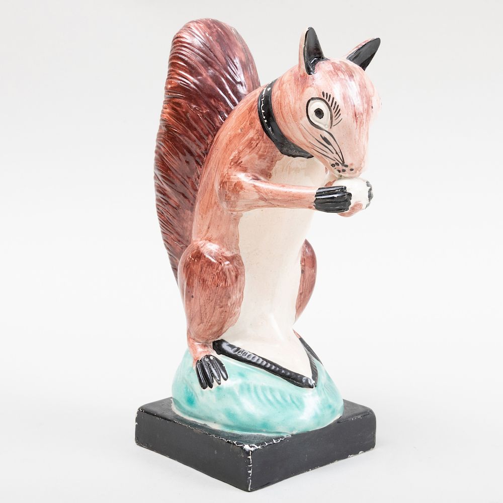 Appraisal: Staffordshire Pearlware Figure of a Squirrel with a Nut in