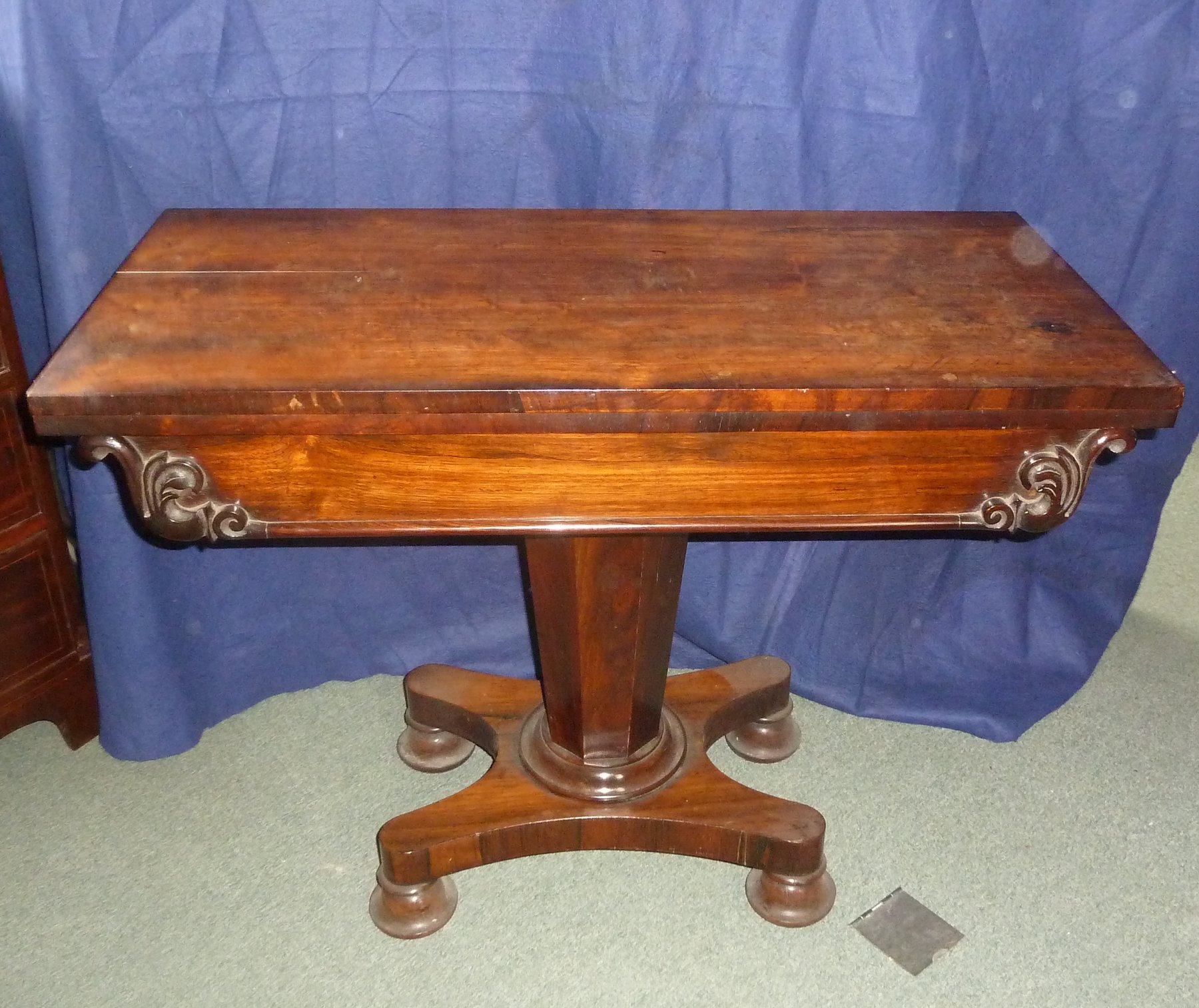 Appraisal: A Regency rosewood card table the rectangular folding top above