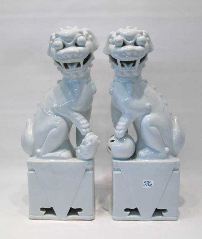 Appraisal: PAIR OF CHINESE BLANC DE CHINE PORCELAIN FOO-DOGS the seated