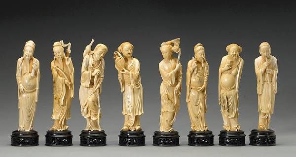 Appraisal: A set of eight carved and tinted ivory figures of