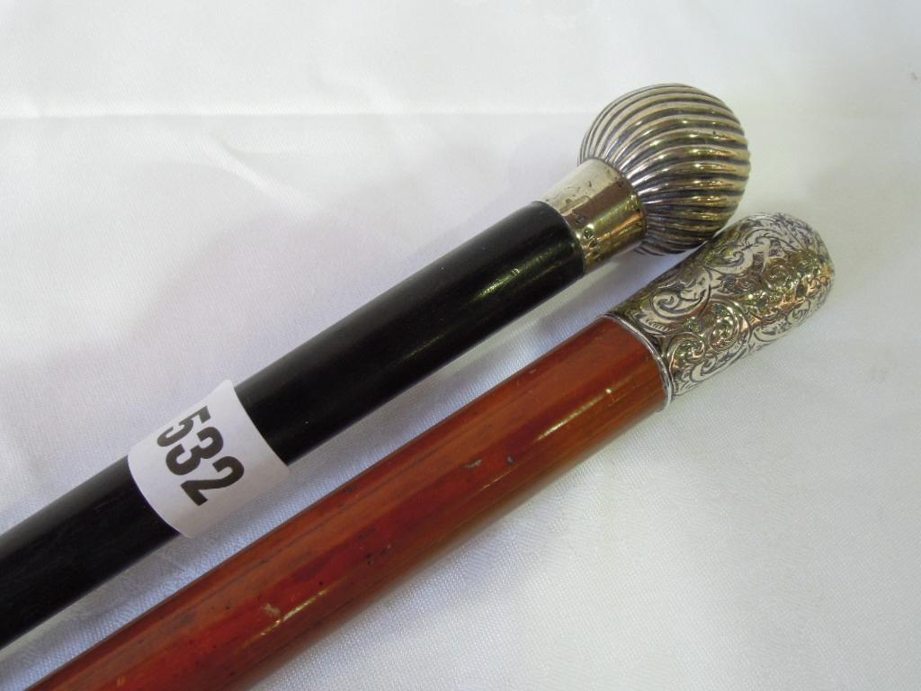 Appraisal: A gentleman's ebony walking stick with a silver spherical and