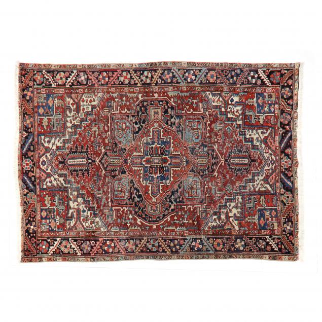 Appraisal: HERIZ RUG Red field with large medallion traditional Heriz design