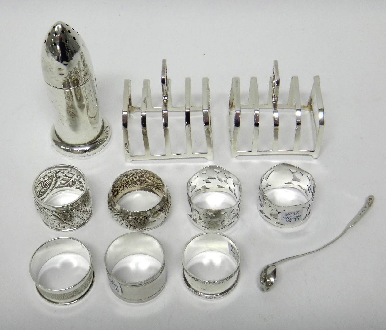 Appraisal: Silver comprising a pair of five bar toastracks each of