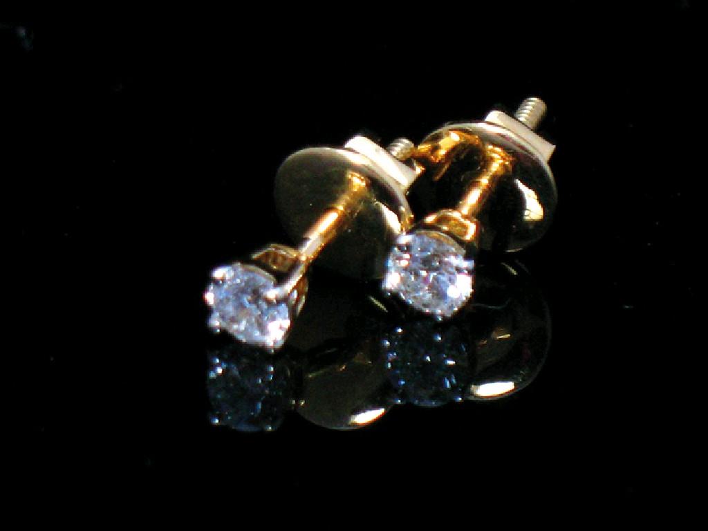 Appraisal: A PAIR OF DIAMOND EAR STUDS each round brilliant-cut diamond