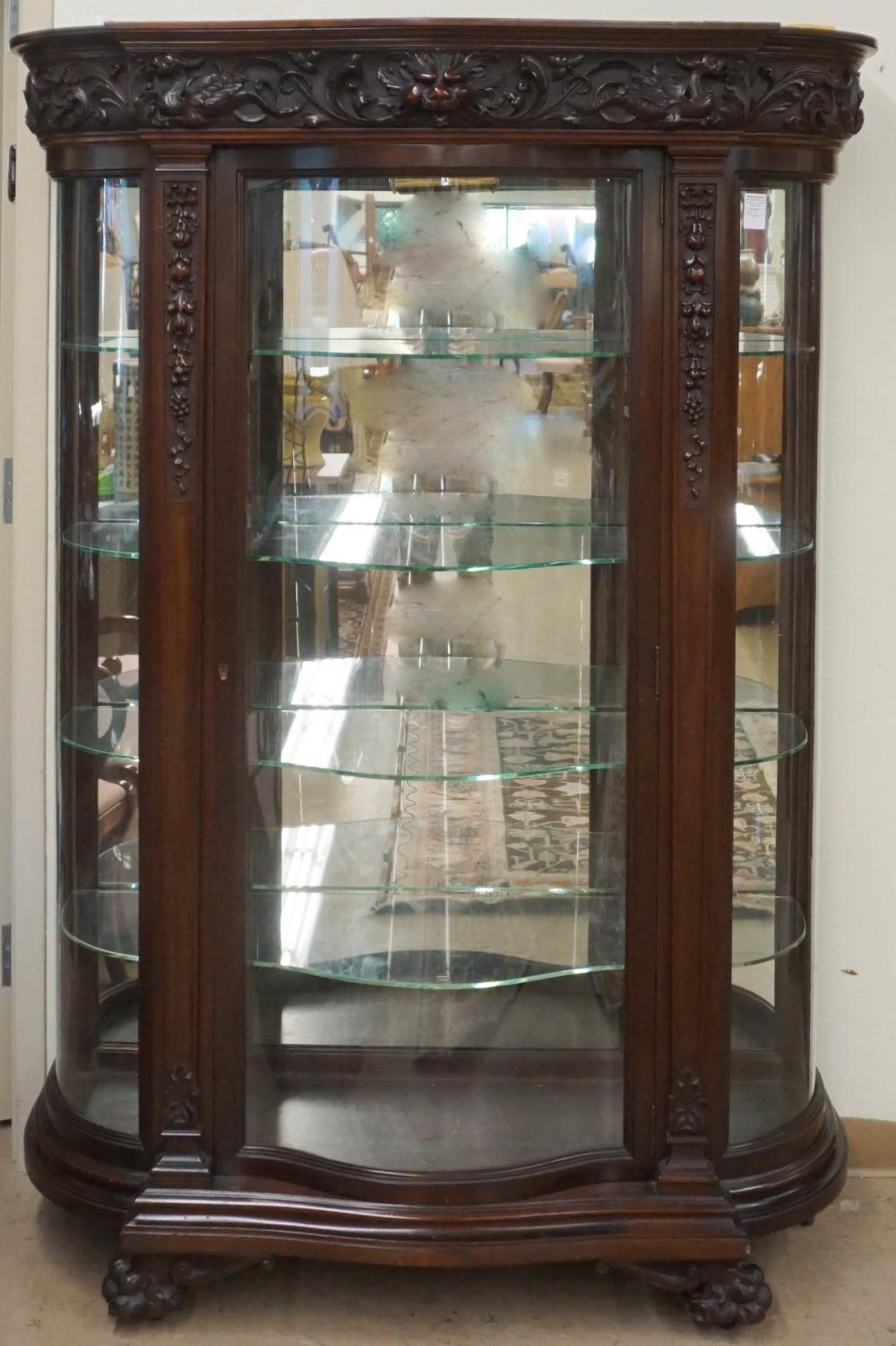 Appraisal: CLASSICAL STYLE CARVED MAHOGANY SERPENTINE GLASS DOOR VITRINE CABINET X