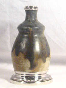 Appraisal: An art pottery stoneware vase in matt glaze with silver