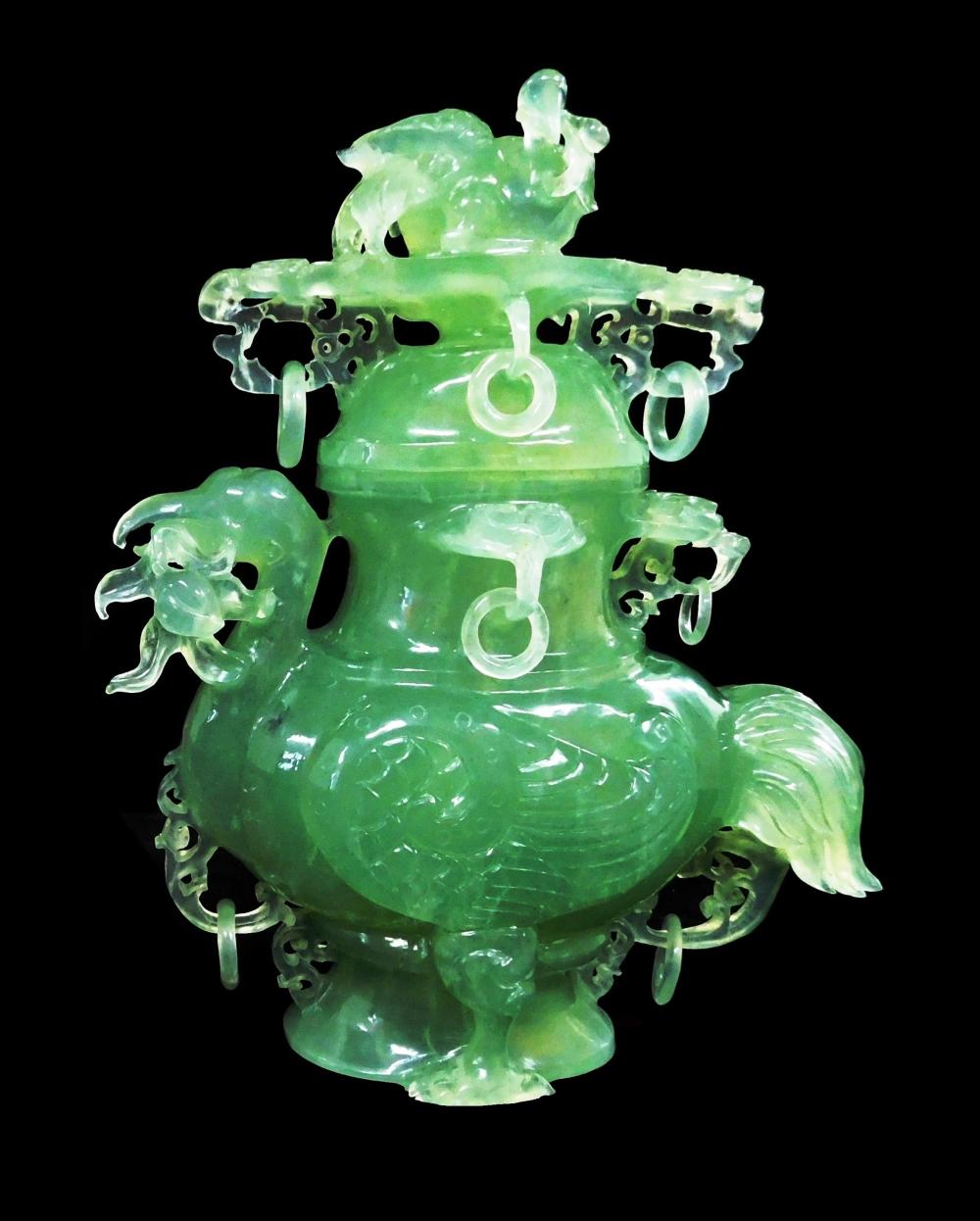 Appraisal: ASIAN Carved translucent green hardstone urn bird-form with flower in