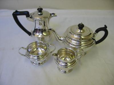 Appraisal: A THREE PIECE TEASET of circular form with ebonised finial