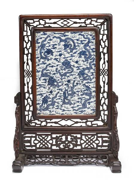 Appraisal: A large blue and white porcelain and wood table screen