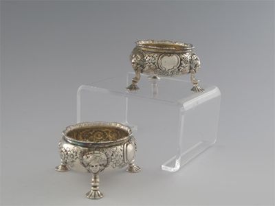 Appraisal: A pair of George II embossed circular salts on mask