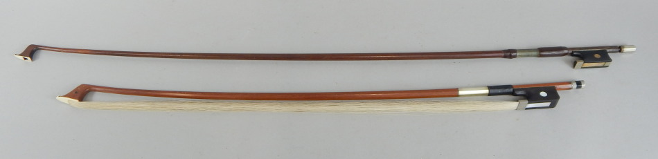 Appraisal: Two violin bows each with silver coloured metal and mother