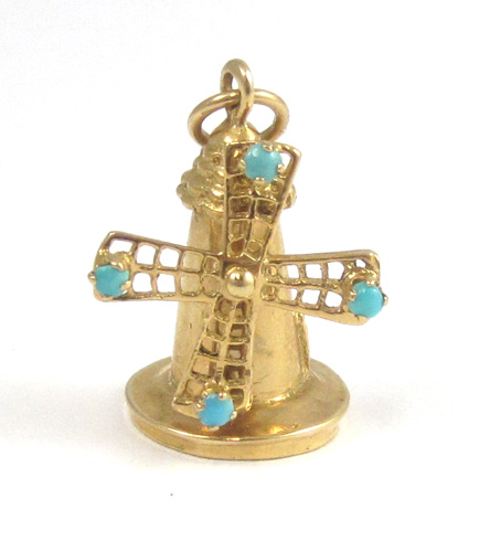 Appraisal: TURQUOISE AND FOURTEEN KARAT GOLD CHARM The fully dimensional yellow