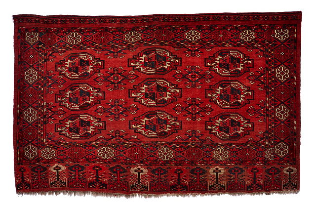 Appraisal: A TURKOMAN ERSARI MID RED GROUND JUVAL with three rows