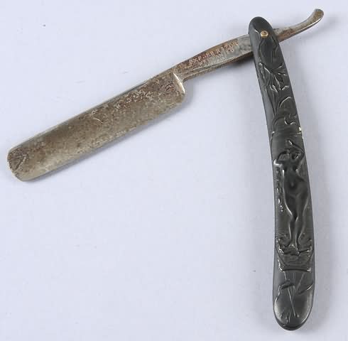 Appraisal: Union thermoplastic straight razor featuring nude Venus motif by Oxford