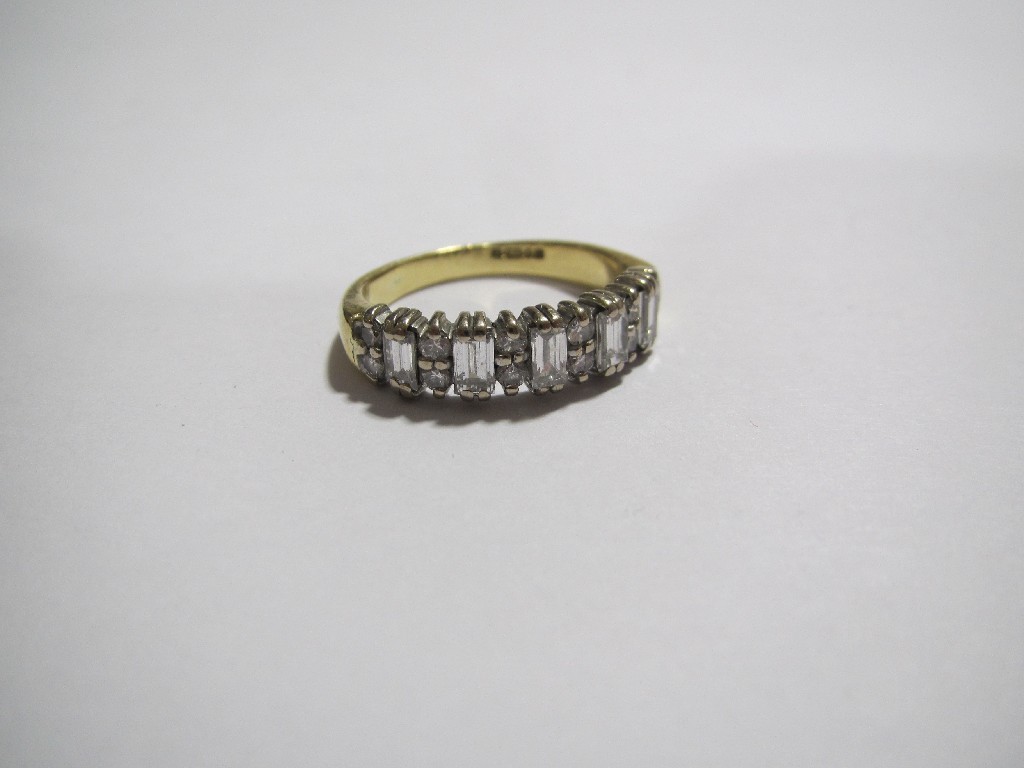 Appraisal: A diamond half hoop eternity ring comprising five rectangular step