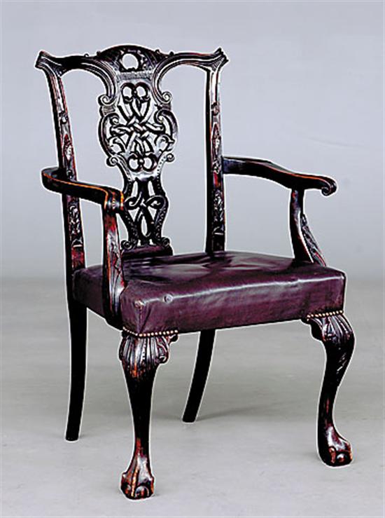 Appraisal: Chinese Chippendale style carved mahogany armchair mid th centurydomed and