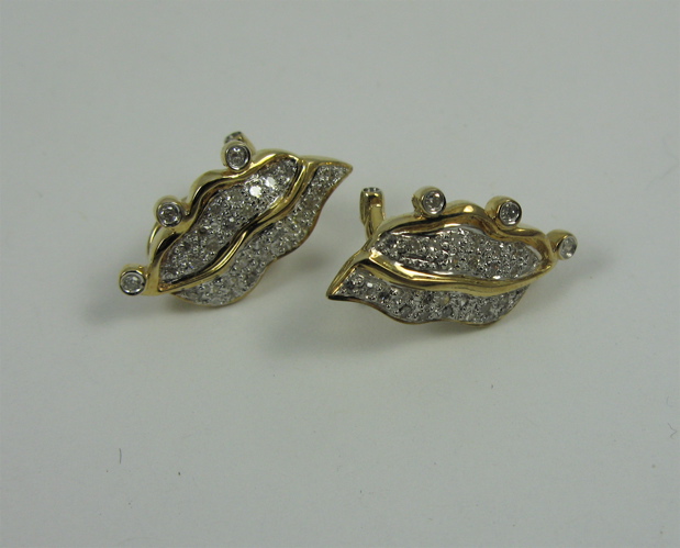 Appraisal: PAIR OF DIAMOND AND K GOLD LEAF EARRINGS each with