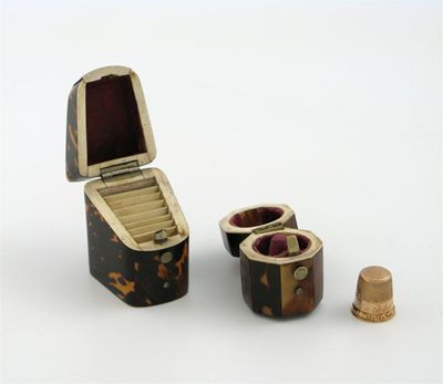 Appraisal: A late Victorian tortoiseshell needle box modelled as a knife