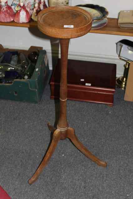 Appraisal: AN ARTS AND CRAFTS STYLE OAK JARDINIERE STAND with disc