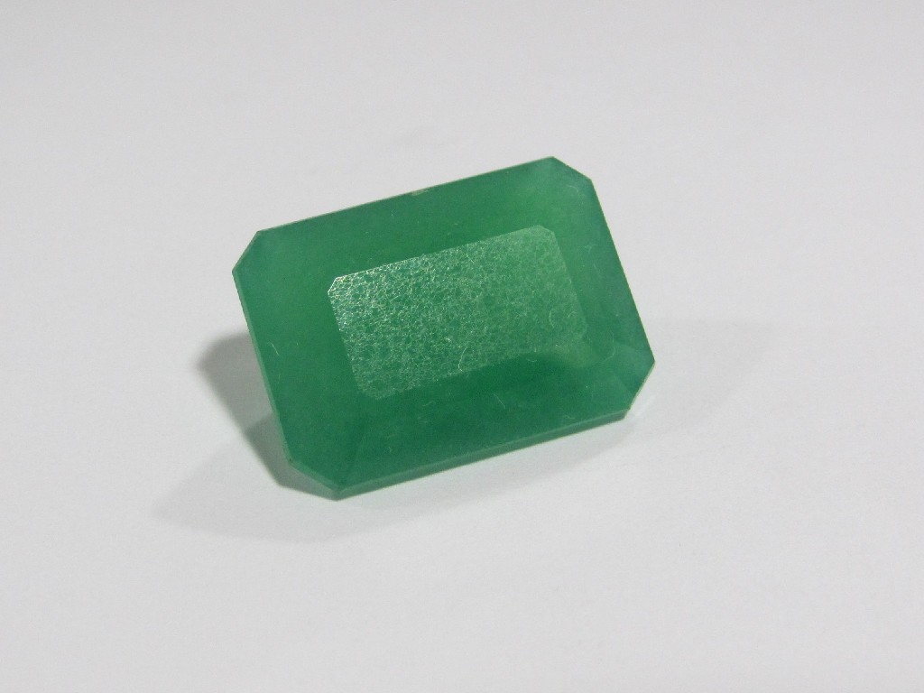 Appraisal: An unmounted step cut jade stone approximately carats