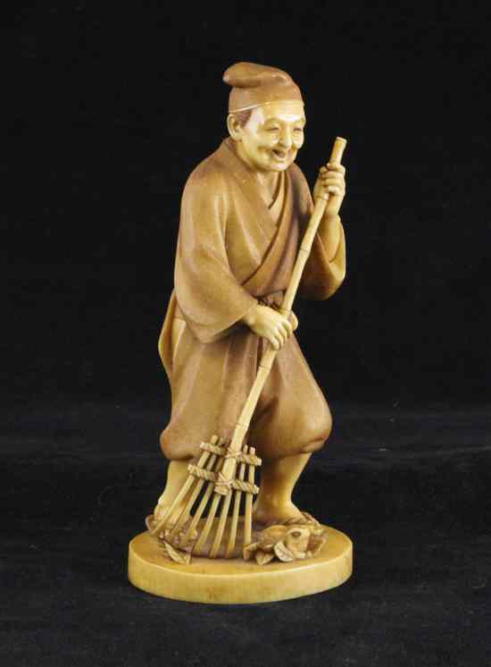 Appraisal: A Japanese stained ivory figure of a gardener Meiji period