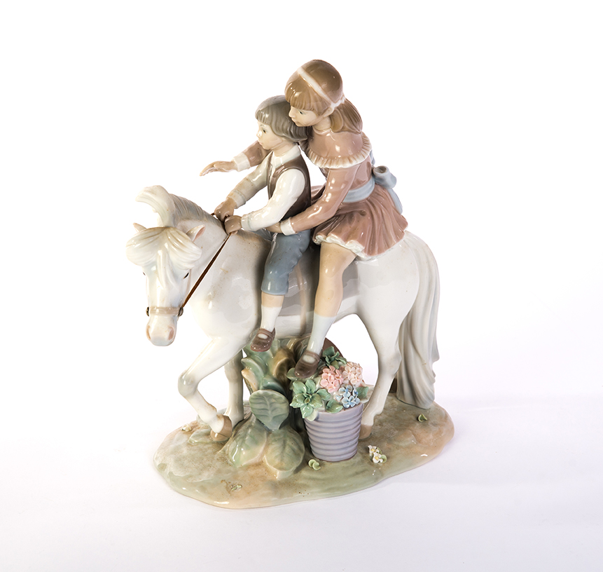 Appraisal: LLADRO FIGURE OF YOUNG BOY AND GIRL ON HORSE Spain