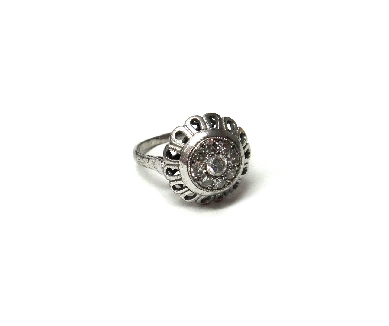 Appraisal: A diamond set nine stone cluster ring mounted with the