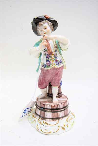 Appraisal: MEISSEN GERMAN PORCELAIN FIGURINE of a young boy standing on