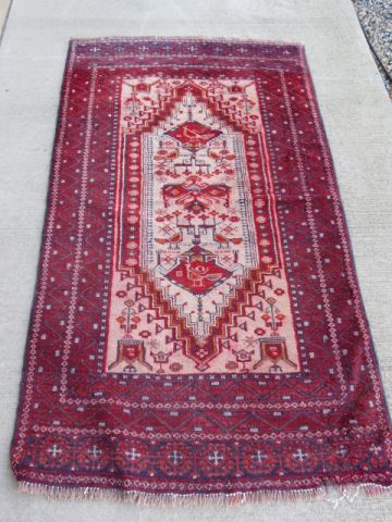 Appraisal: Belouchi Persian Handmade Rug geometrics reds blue and ivory '