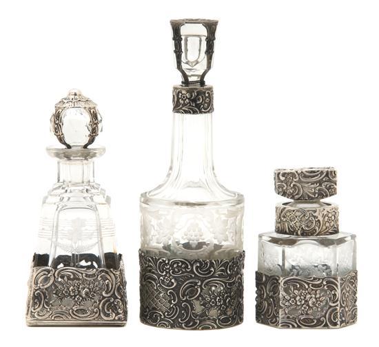 Appraisal: Group of Three Continental Etched Glass and Silver Overlay Bottles