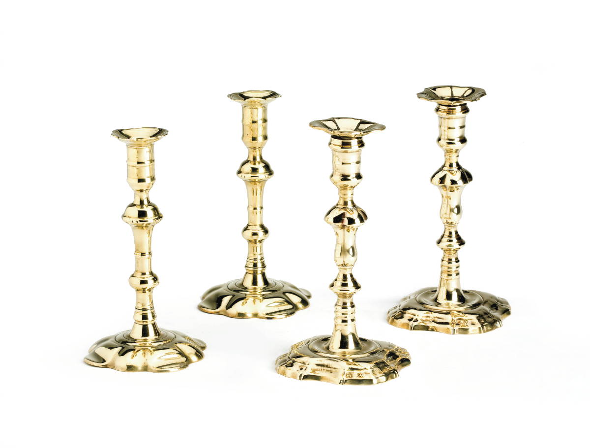 Appraisal: TWO PAIR OF ENGLISH BRASS CANDLESTICKS The first of silver