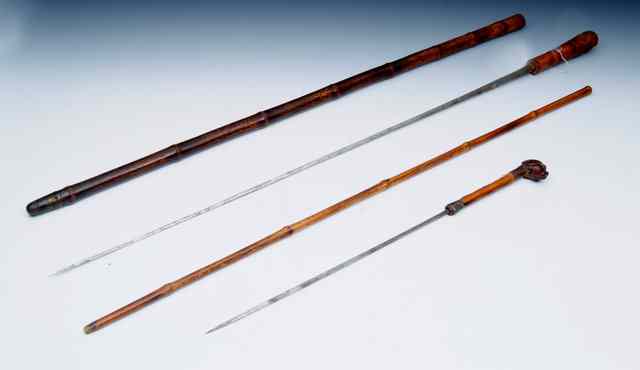 Appraisal: A WALKING CANE SWORD STICK with bamboo shaft the handle