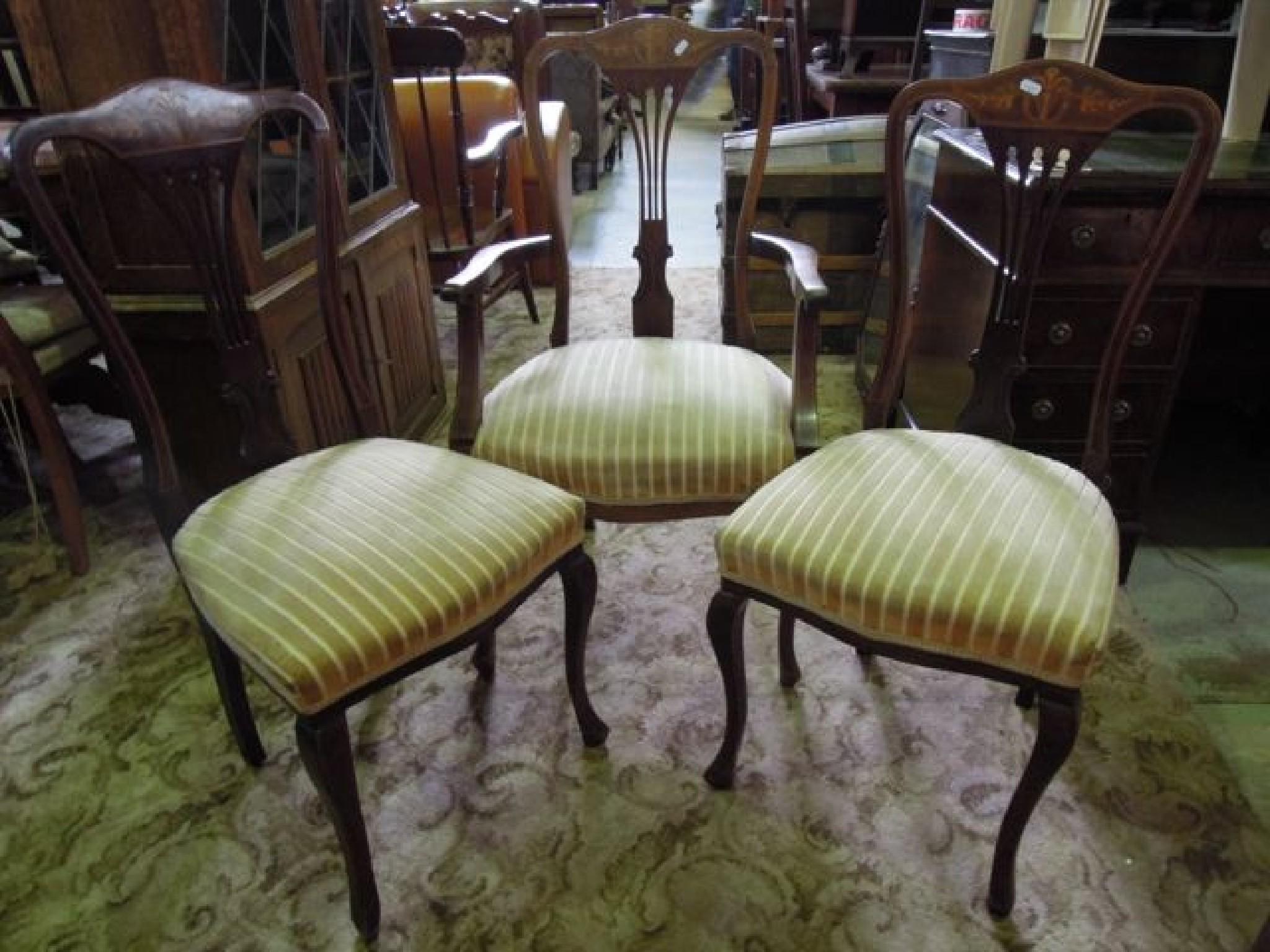 Appraisal: An inlaid Edwardian mahogany open elbow chair with pierced comb