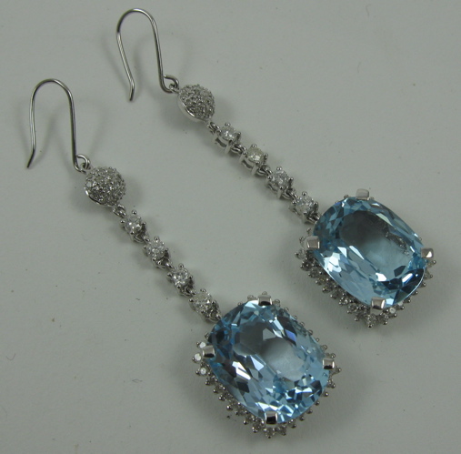 Appraisal: PAIR OF DIAMOND AND BLUE TOPAZ PENDANT EARRINGS K white