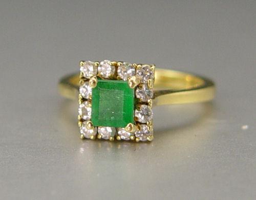 Appraisal: K EMERALD DIAMOND RING K yellow gold ring contains one