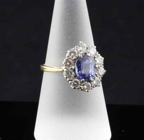 Appraisal: A 's ct gold sapphire and diamond oval cluster ring