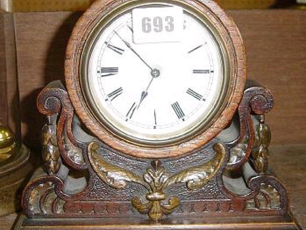 Appraisal: A small Victorian mantle clock with a carved and pierced