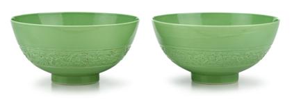 Appraisal: Pair of Chinese carved lime green monochrome porcelain bowlsqianlong seal