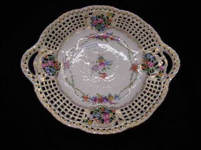 Appraisal: Handpainted German Porcelain Cake Plate fancy openwork basket trim floral