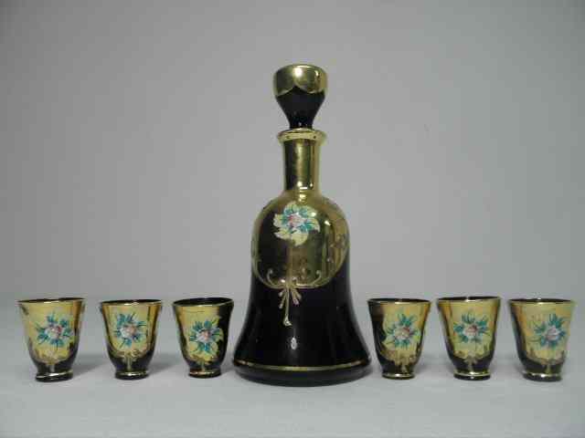 Appraisal: Venetian enameled amethyst glass liquor set Includes pieces decanter and