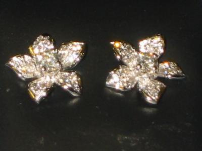 Appraisal: A PAIR OF DIAMOND EARRINGS of stud form modelled as