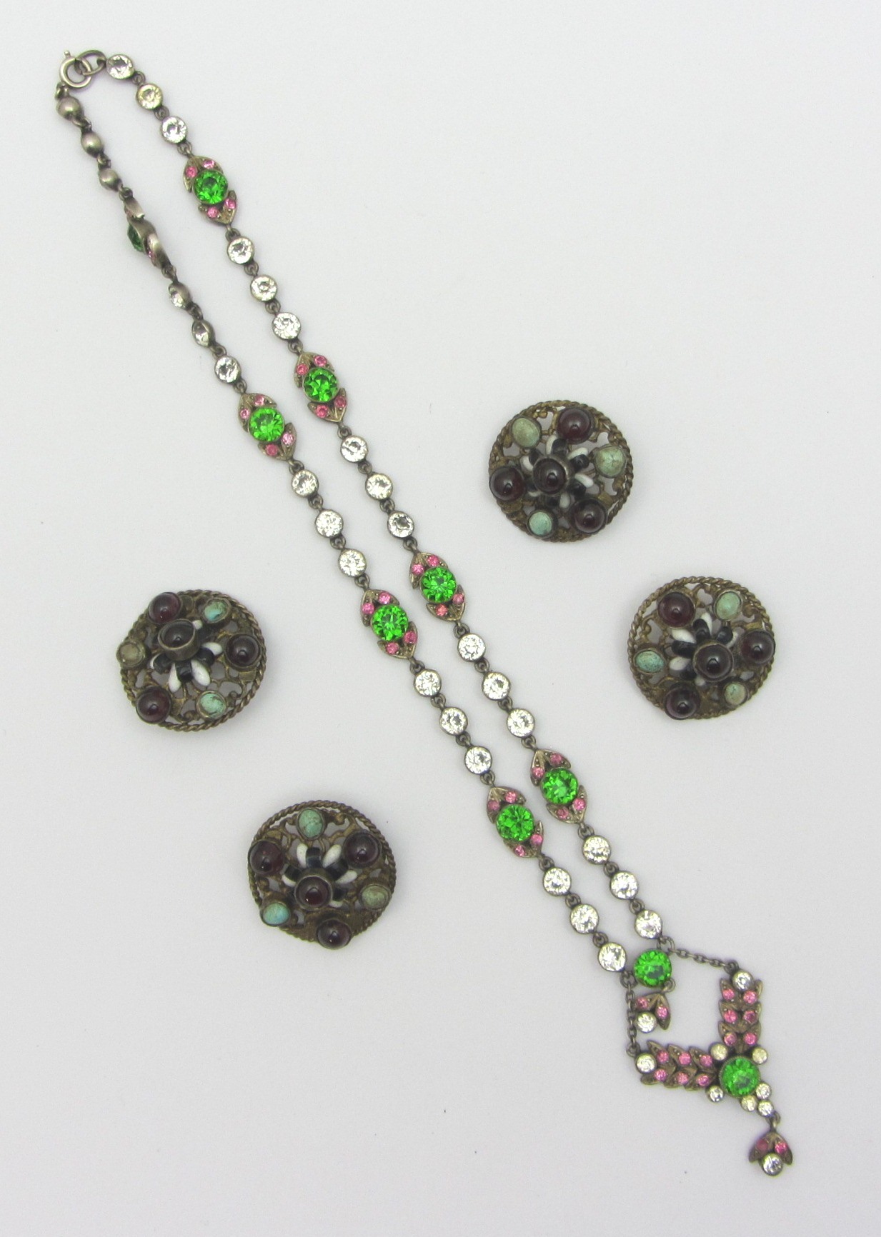 Appraisal: A green pink and colourless paste set necklace with foliate