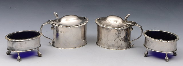 Appraisal: A PAIR OF OVAL SHAPED MUSTARD POTS with gadrooned edges