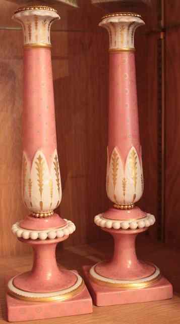 Appraisal: A PAIR OF MANGANI PINK AND PARCEL GILT PORCELAIN CANDLESTICKS