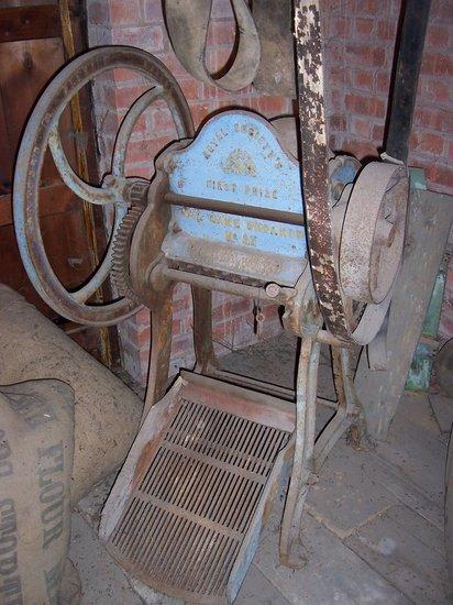 Appraisal: A belt driven oil cake breaker No SX marked 'Royal