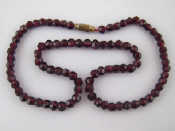 Appraisal: A garnet bead necklace beads approx mm cm