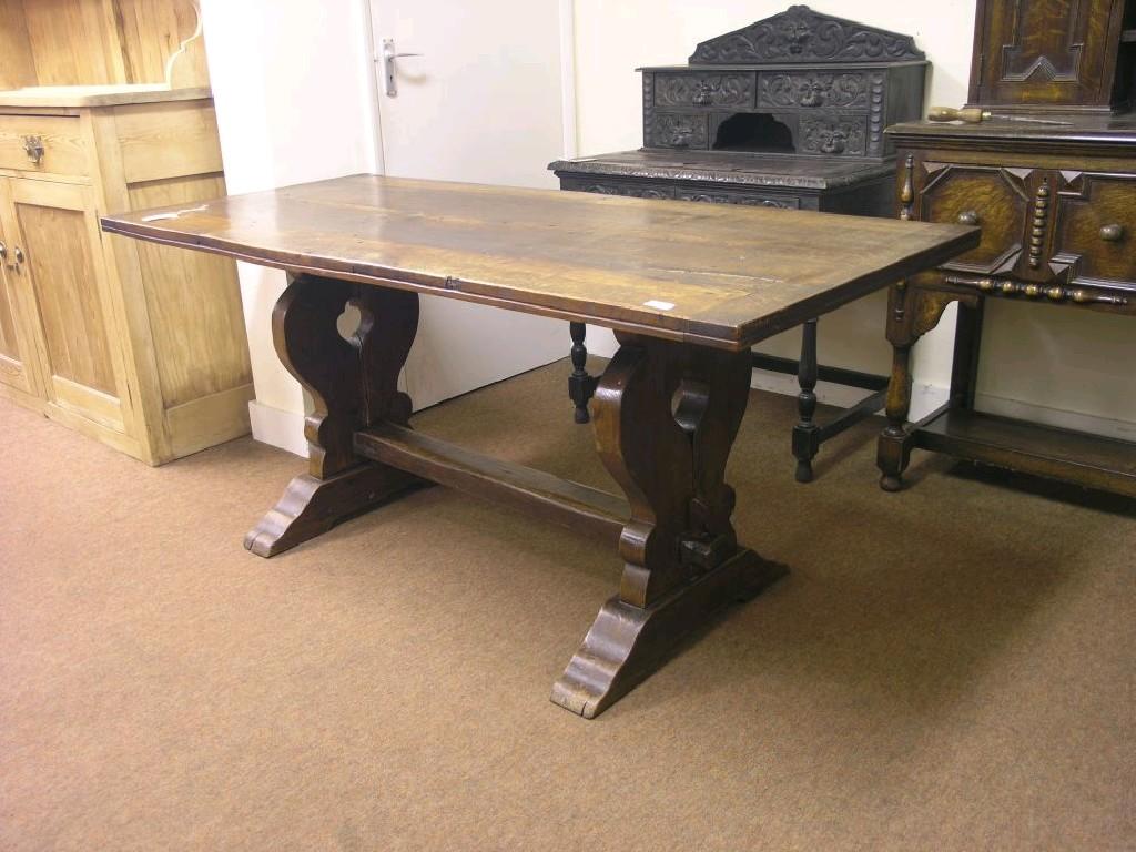 Appraisal: An early th century solid oak dining table refectory-type on