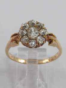 Appraisal: A yellow metal diamond cluster ring probably Russian